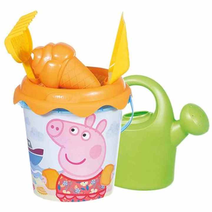 Il Secchio Di Plastica Ed Il Rastrello Del Bambino in Sabbia Immagine
